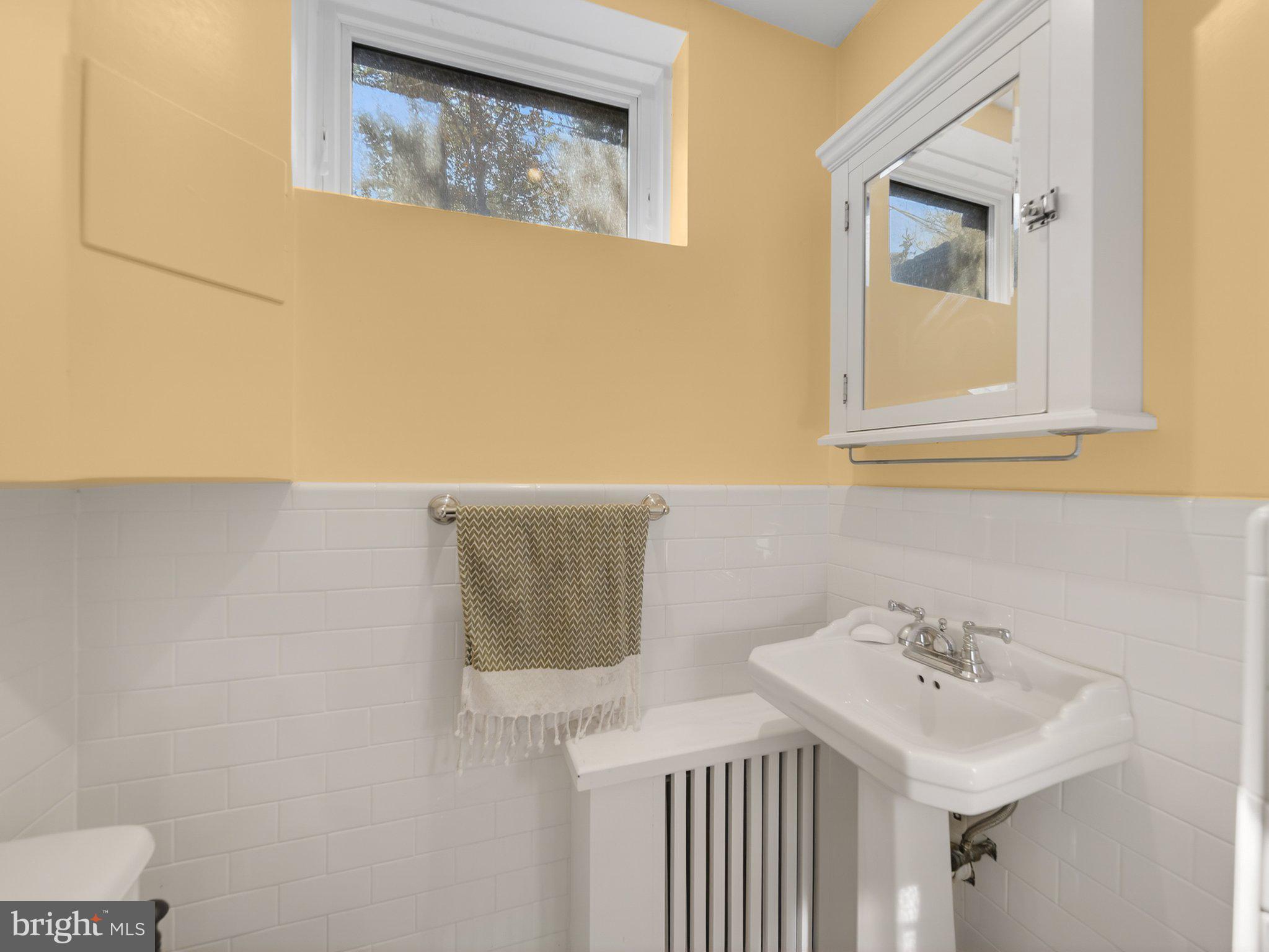 2119 Huidekoper Place Northwest Washington, DC 20007 - Photo 37 of 37 Charming bathroom with sunny hues.