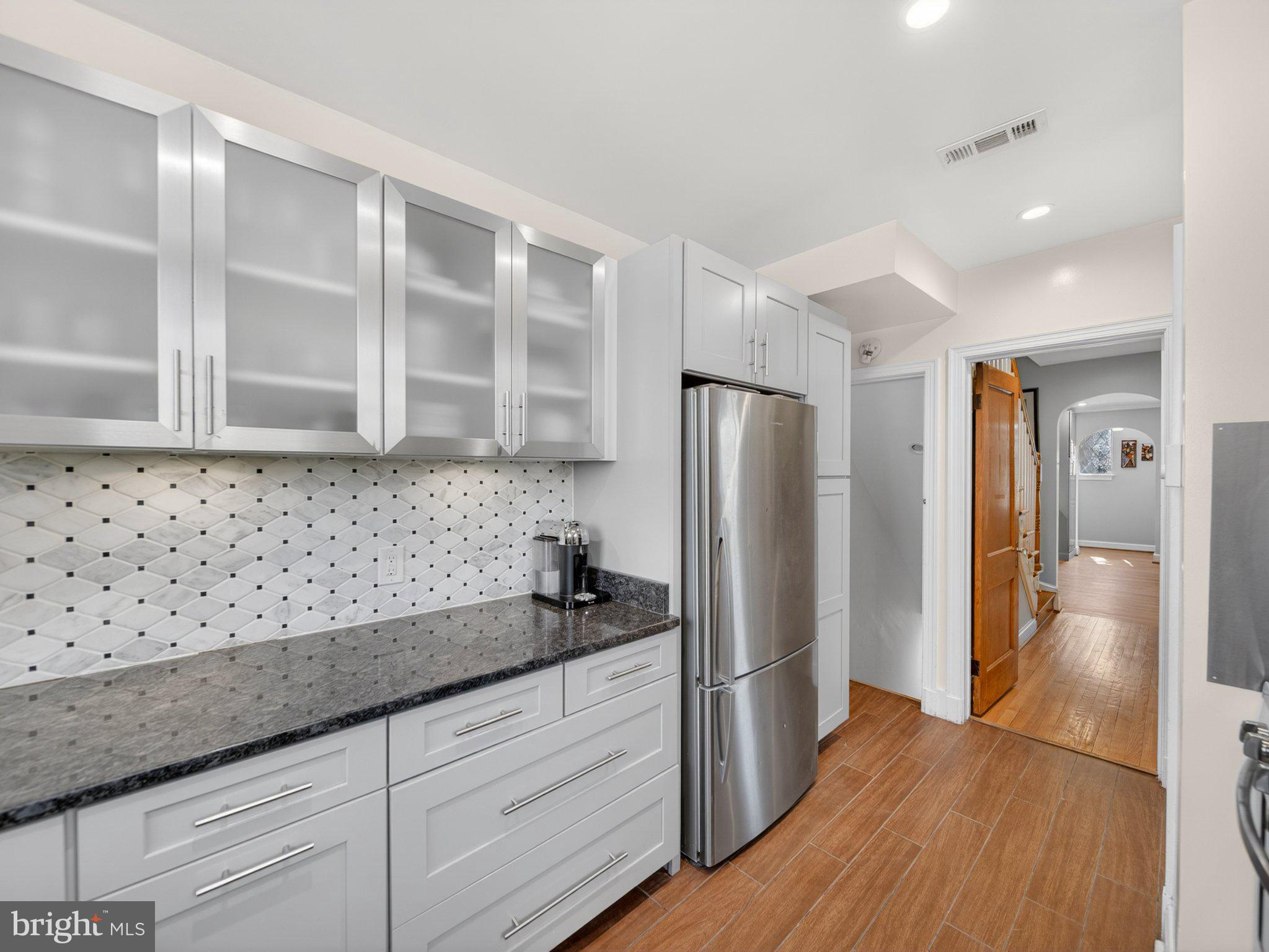 2119 Huidekoper Place Northwest Washington, DC 20007 - Photo 4 of 37 Sleek modern kitchen with stylish finishes.