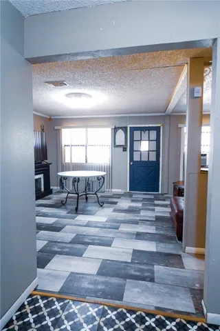 a view of entryway with a front door