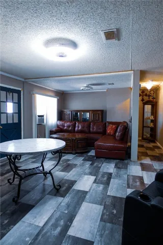 a living room with furniture and a rug