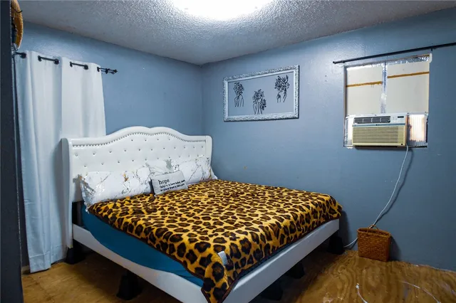 a bedroom with a bed and window