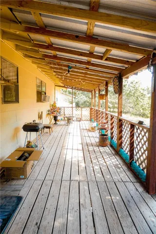 a outdoor space with lots of furniture and wooden floor