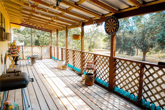 a balcony with wooden floor