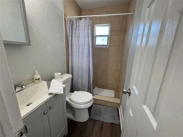 a white toilet sitting next to a bathroom sink