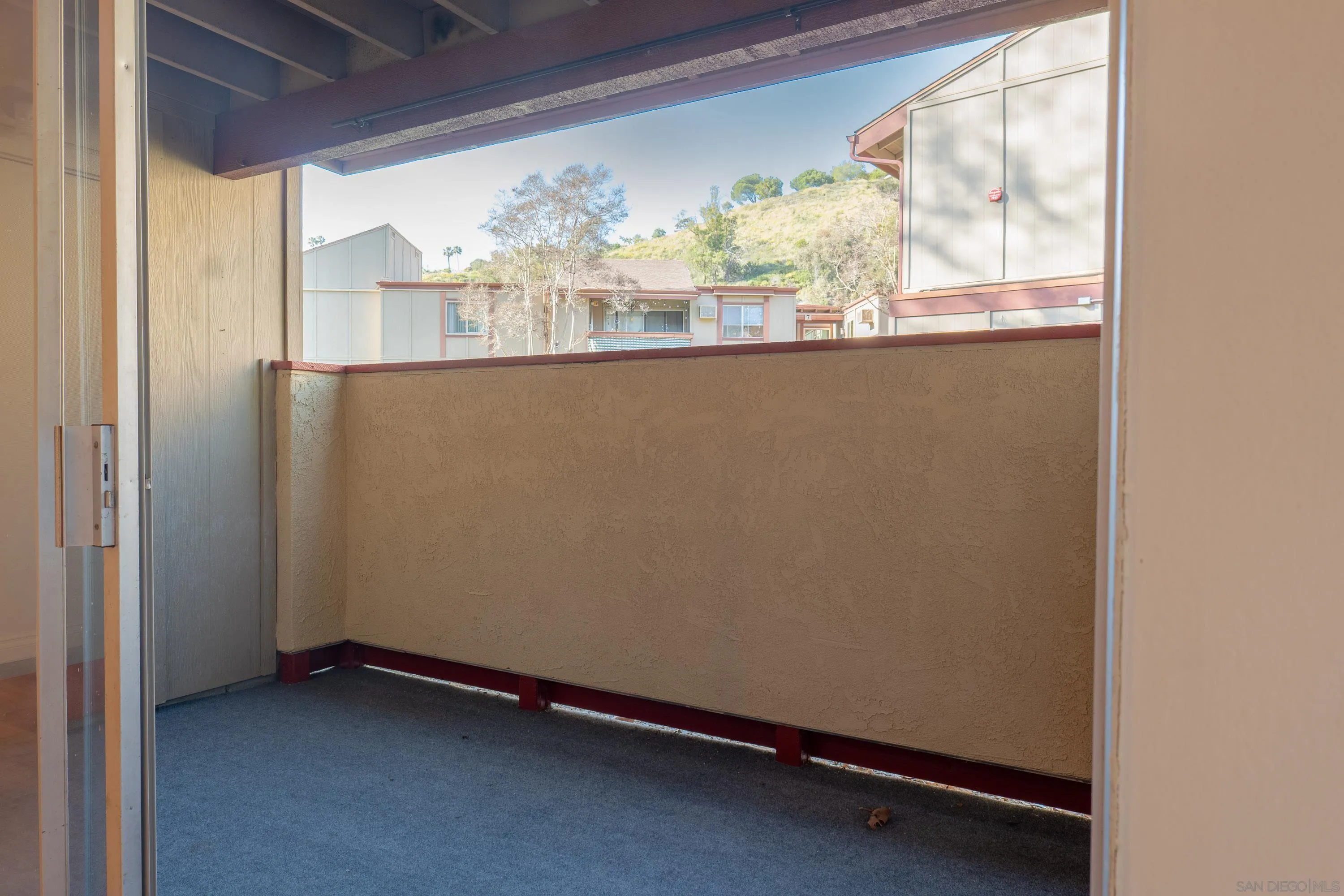 5513 Adobe Falls Road, Unit 2 San Diego, CA 92120 - Photo 19 of 40 a view of a room with wooden floor and windows