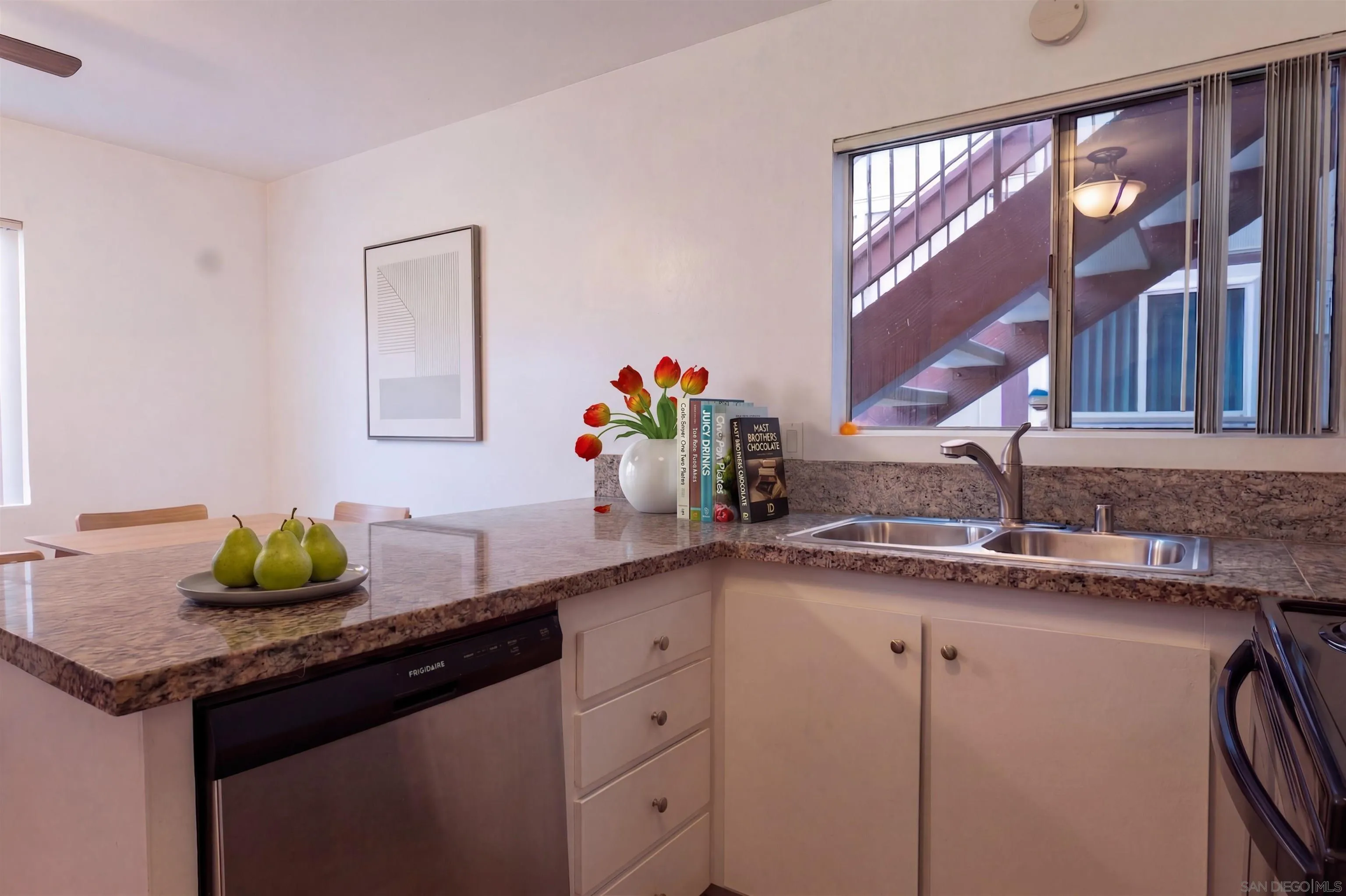 5513 Adobe Falls Road, Unit 2 San Diego, CA 92120 - Photo 2 of 40 a kitchen with a sink and a window