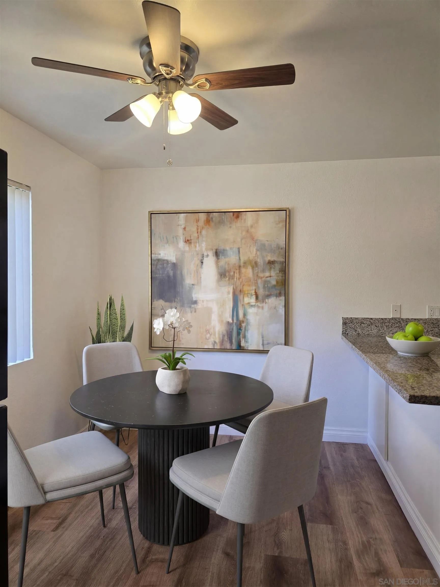 5513 Adobe Falls Road, Unit 2 San Diego, CA 92120 - Photo 3 of 40 a view of a dining room with furniture and wooden floor