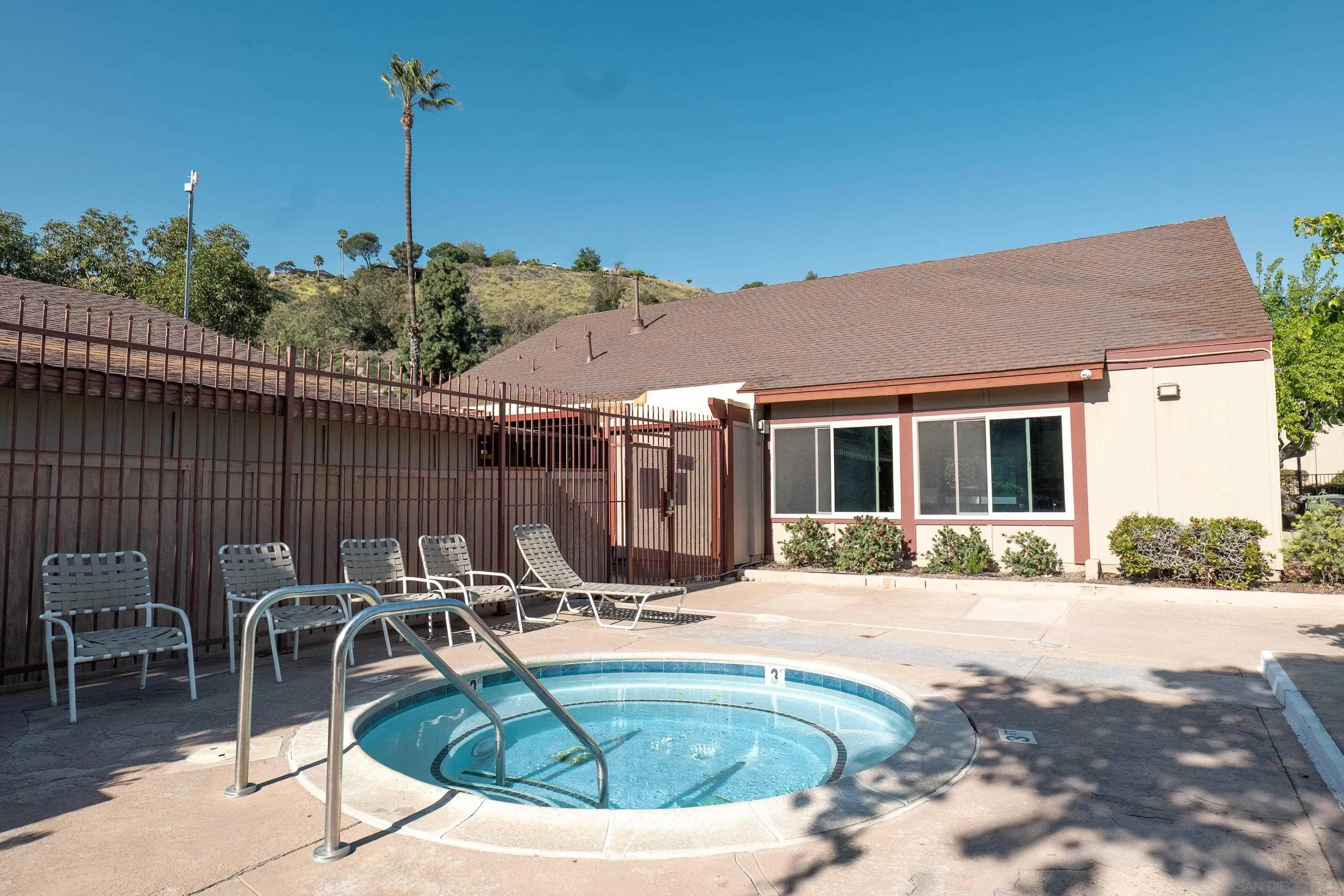 5513 Adobe Falls Road, Unit 2 San Diego, CA 92120 - Photo 32 of 40 a view of a house with swimming pool and sitting area
