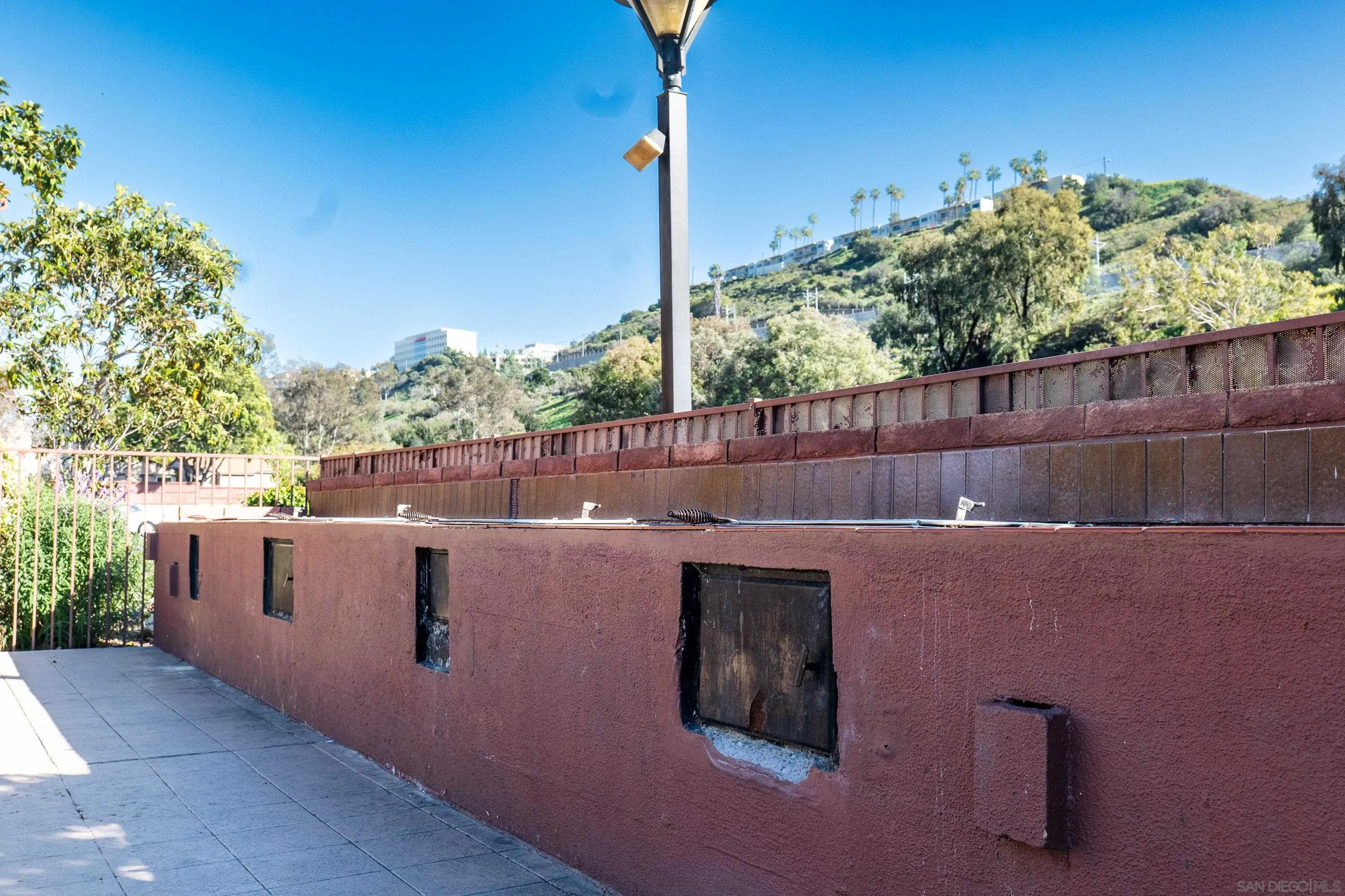 5513 Adobe Falls Road, Unit 2 San Diego, CA 92120 - Photo 33 of 40 a backyard of a house with lots of green space