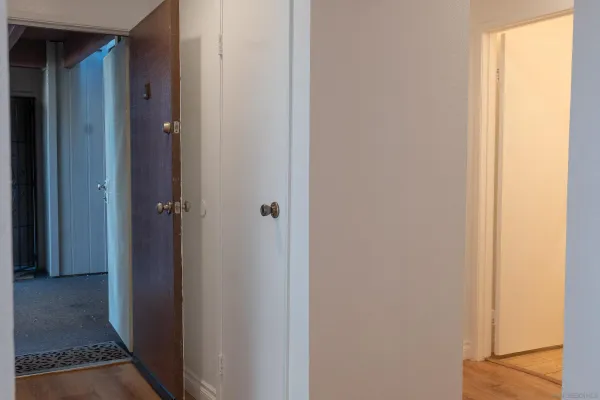 a view of a bathroom from a hallway