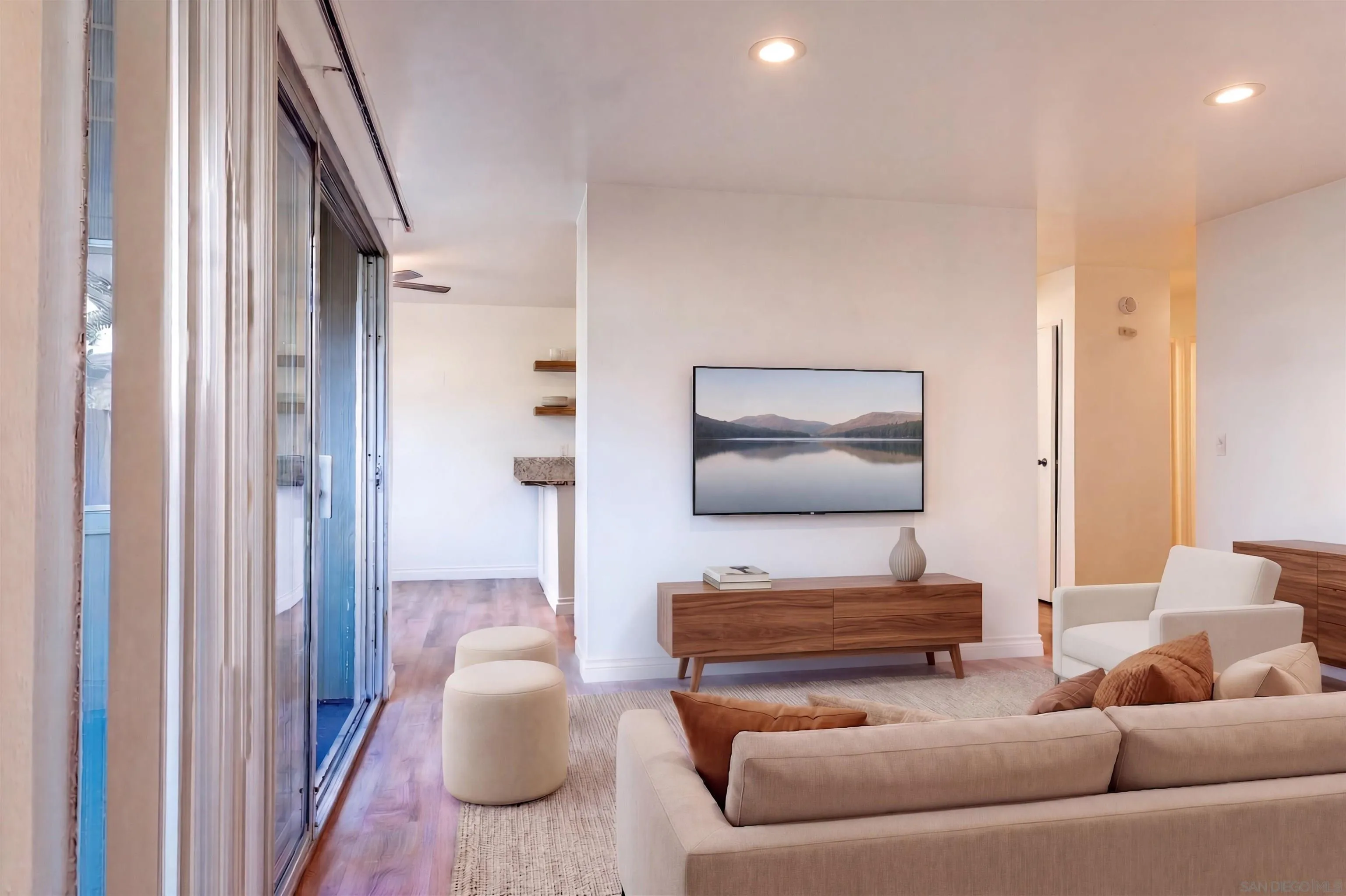5513 Adobe Falls Road, Unit 2 San Diego, CA 92120 - Photo 5 of 40 a living room with furniture and a flat screen tv