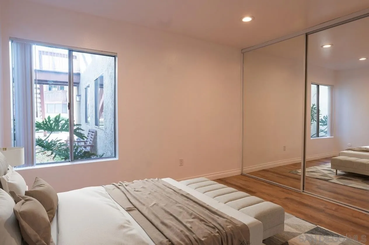 5513 Adobe Falls Road, Unit 2 San Diego, CA 92120 - Photo 6 of 40 a bedroom with a bed and a window