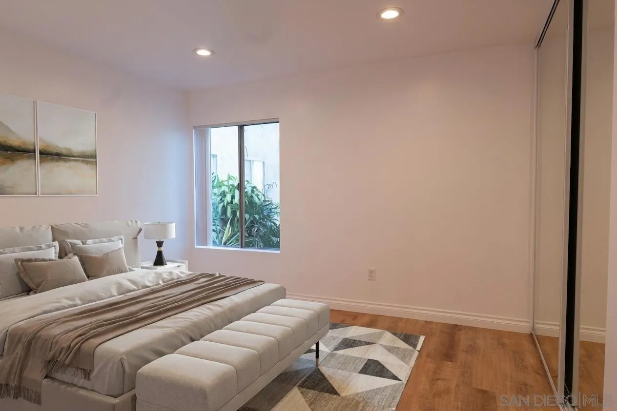 5513 Adobe Falls Road, Unit 2 San Diego, CA 92120 - Photo 7 of 40 a bedroom with a bed and a window