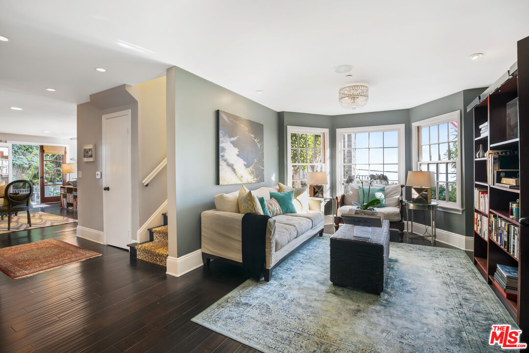 2962 Valmere Drive Malibu, CA 90265 - Photo 12 of 50 a living room with furniture and a book shelf
