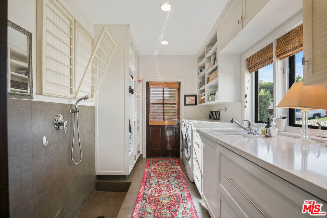 2962 Valmere Drive Malibu, CA 90265 - Photo 15 of 50 a large bathroom with a sink a mirror a vanity and a shower