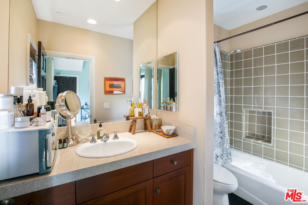 2962 Valmere Drive Malibu, CA 90265 - Photo 17 of 50 a bathroom with a sink and a mirror