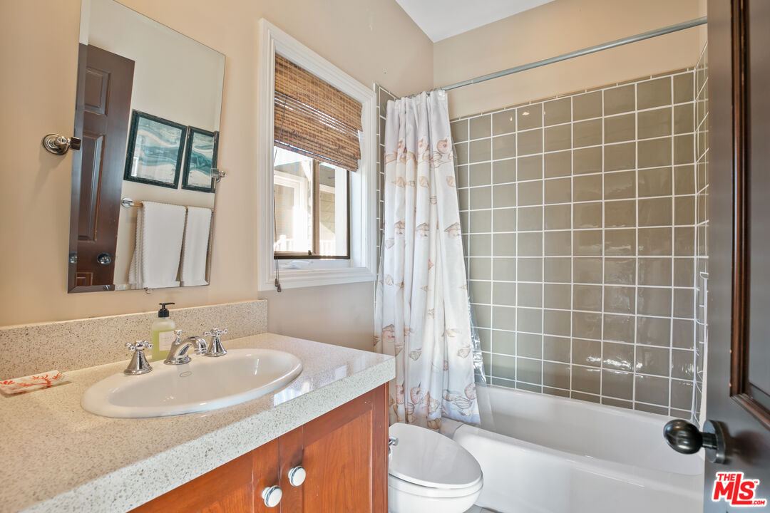 2962 Valmere Drive Malibu, CA 90265 - Photo 22 of 50 a bathroom with a sink a toilet and shower