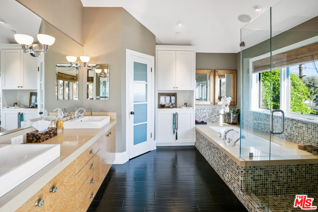 2962 Valmere Drive Malibu, CA 90265 - Photo 25 of 50 a large white kitchen with a large window a sink and cabinets