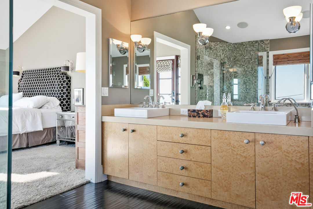 2962 Valmere Drive Malibu, CA 90265 - Photo 27 of 50 a bathroom with a double vanity sink mirror and