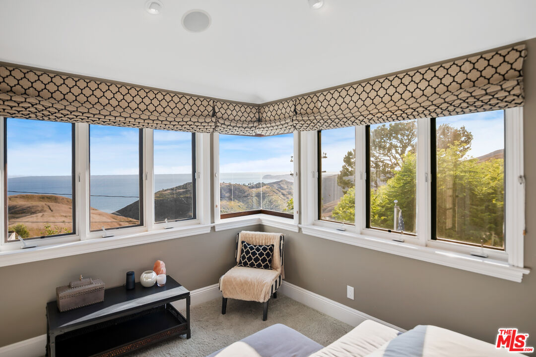 2962 Valmere Drive Malibu, CA 90265 - Photo 29 of 50 a living room with furniture and a large window