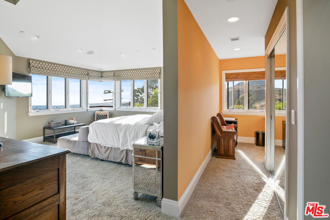 2962 Valmere Drive Malibu, CA 90265 - Photo 32 of 50 a bedroom with a bed and a dresser