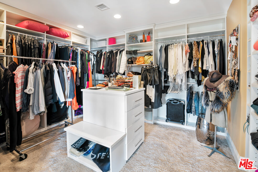2962 Valmere Drive Malibu, CA 90265 - Photo 34 of 50 a view of walk in closet with clothes