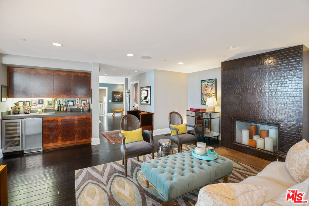 2962 Valmere Drive Malibu, CA 90265 - Photo 9 of 50 a living room with furniture and a fireplace
