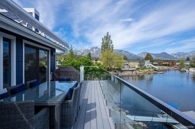 a view of a balcony with sitting area