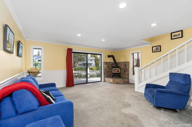 a living room with furniture and a gym machine