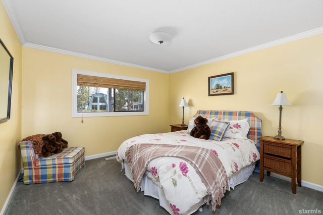 a bedroom with bed and a window