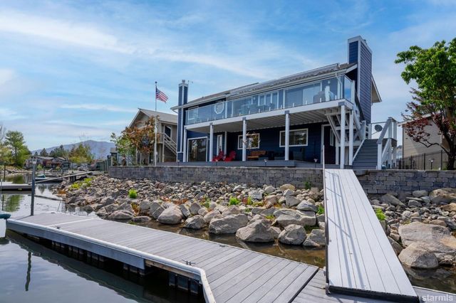 a view of a house with wooden deck
