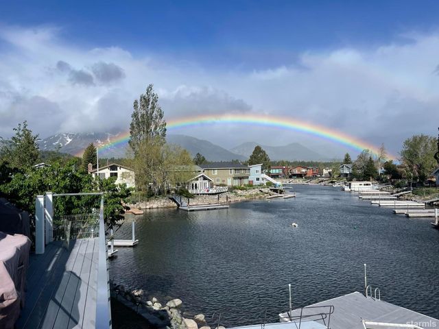 an aerial view of a house with a lake view