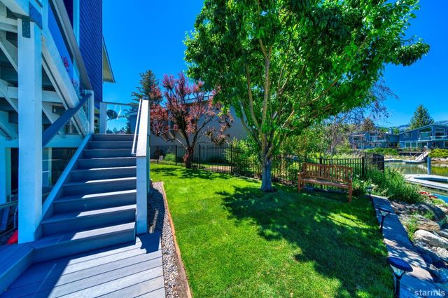 a view of a yard with large trees