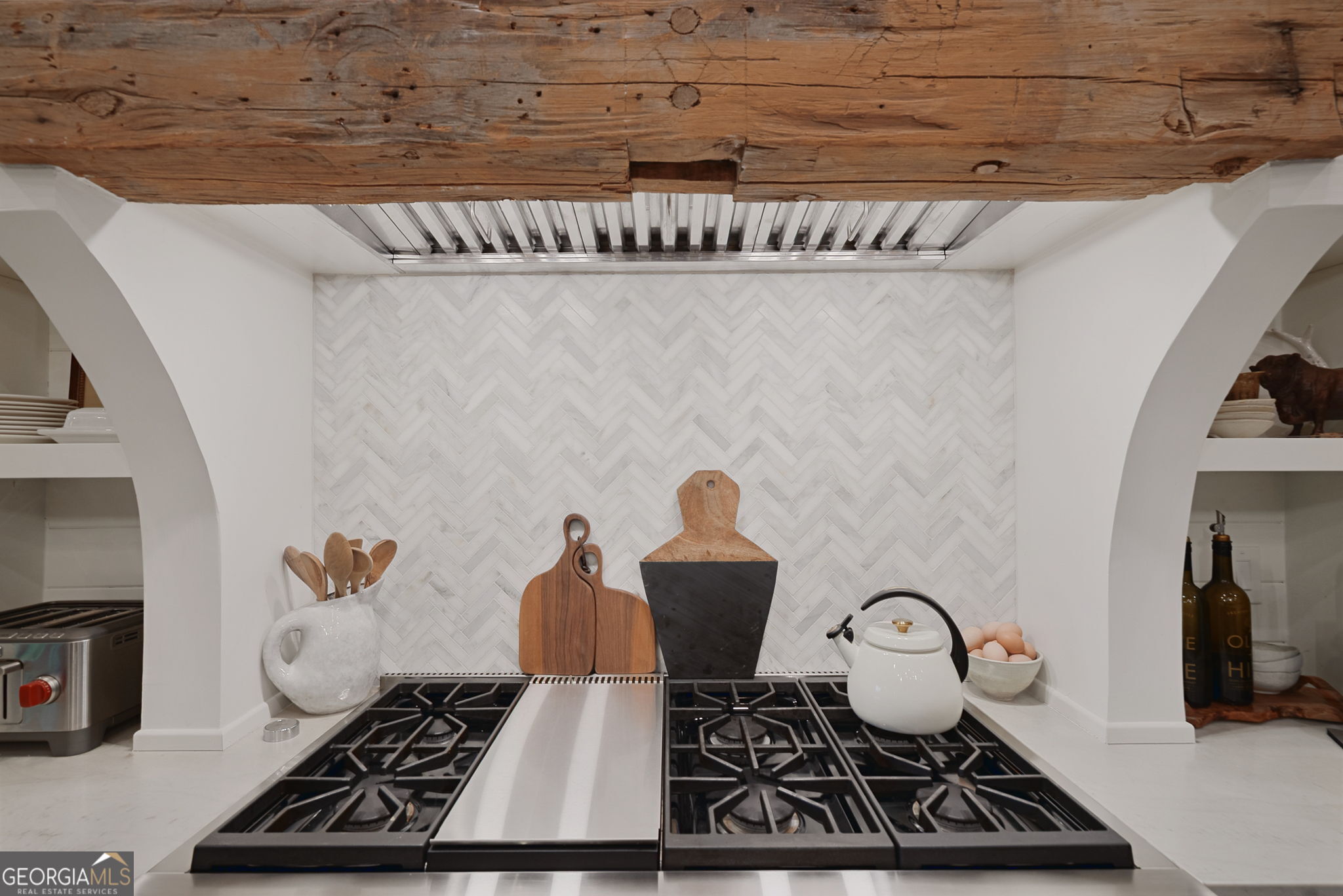 235 Glades Road Eatonton, GA 31024 - Photo 18 of 79 a table with a stove and a fireplace
