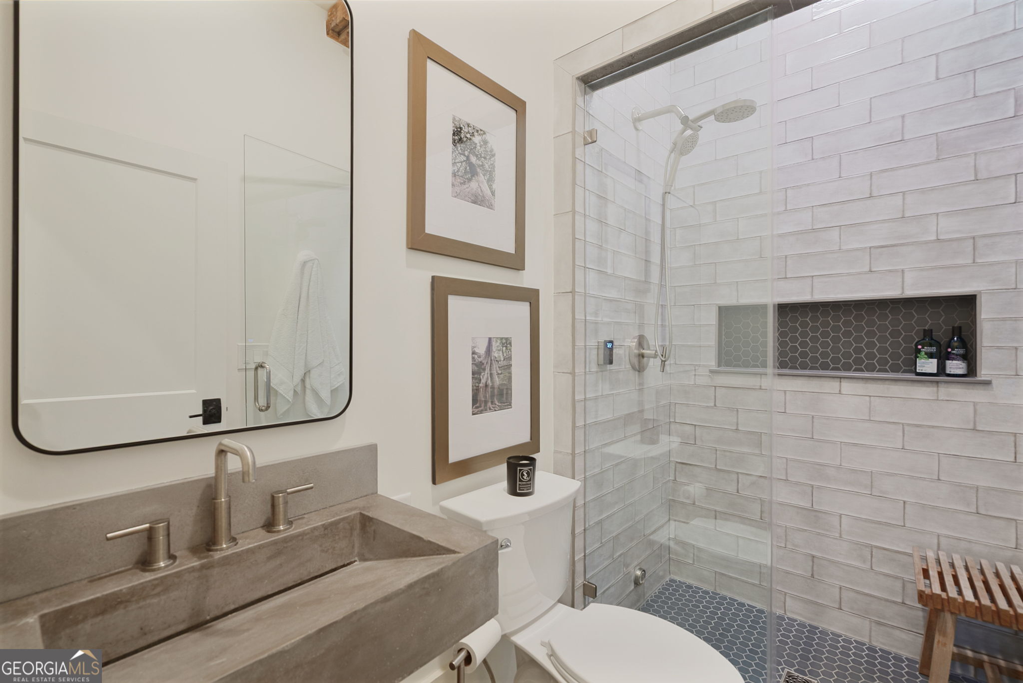 235 Glades Road Eatonton, GA 31024 - Photo 21 of 79 a bathroom with a toilet sink and shower