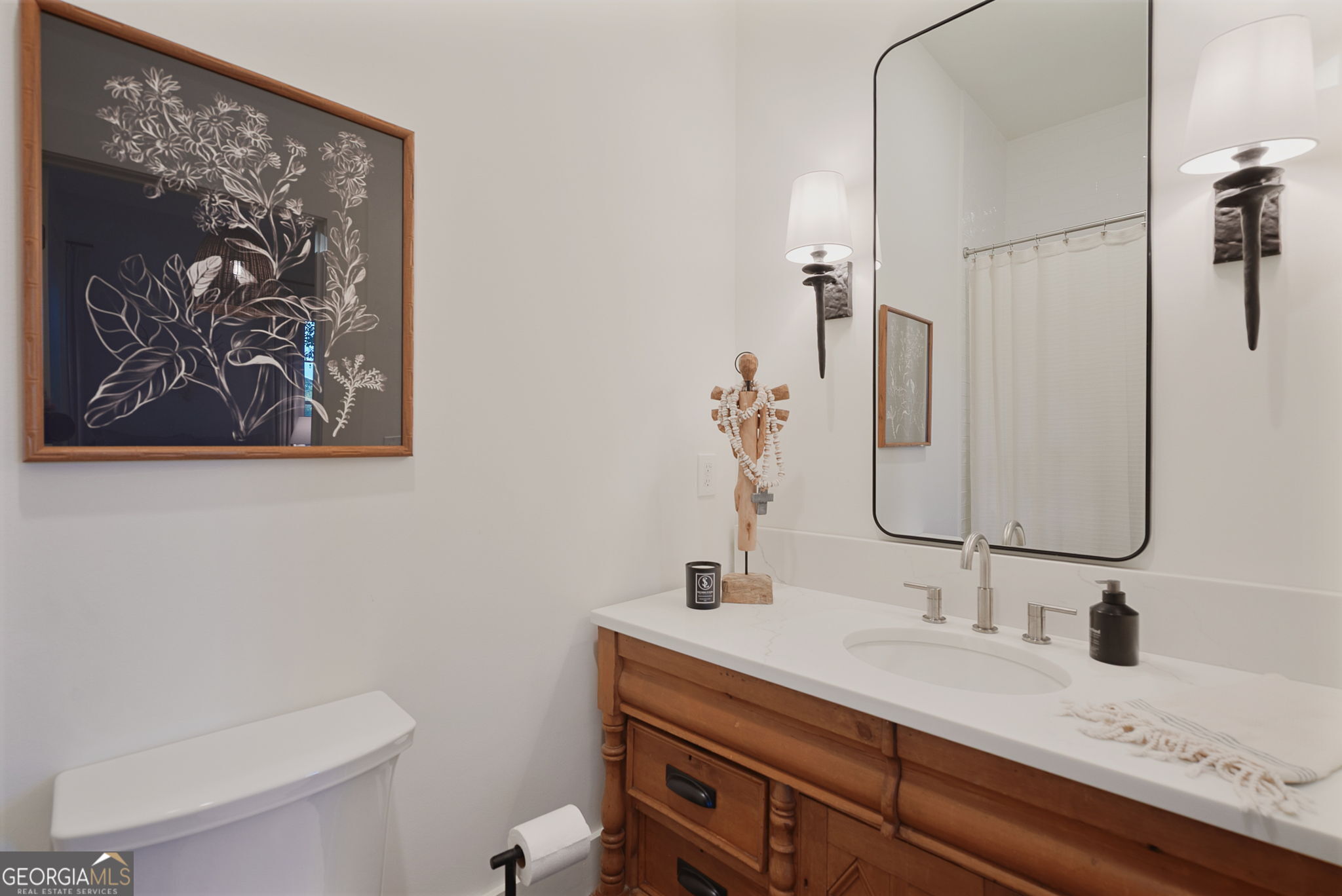 235 Glades Road Eatonton, GA 31024 - Photo 23 of 79 a bathroom with a granite countertop sink mirror and toilet