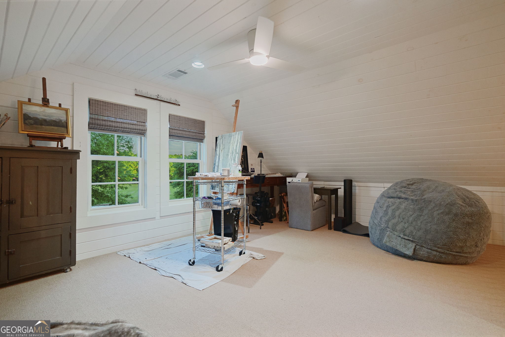 235 Glades Road Eatonton, GA 31024 - Photo 29 of 79 a living room with furniture a flat screen tv and a fireplace