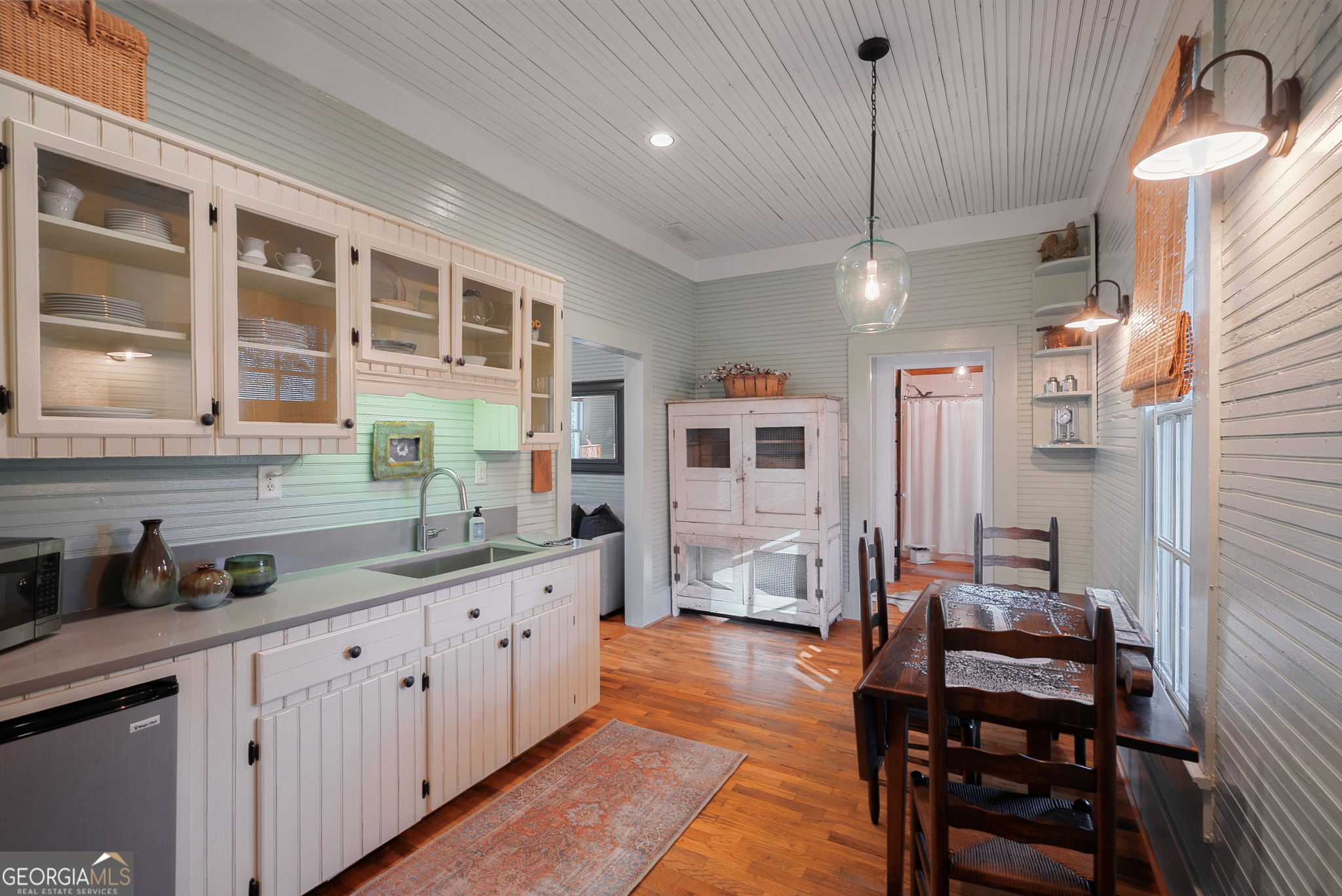 235 Glades Road Eatonton, GA 31024 - Photo 32 of 79 a kitchen with cabinets a sink and appliances
