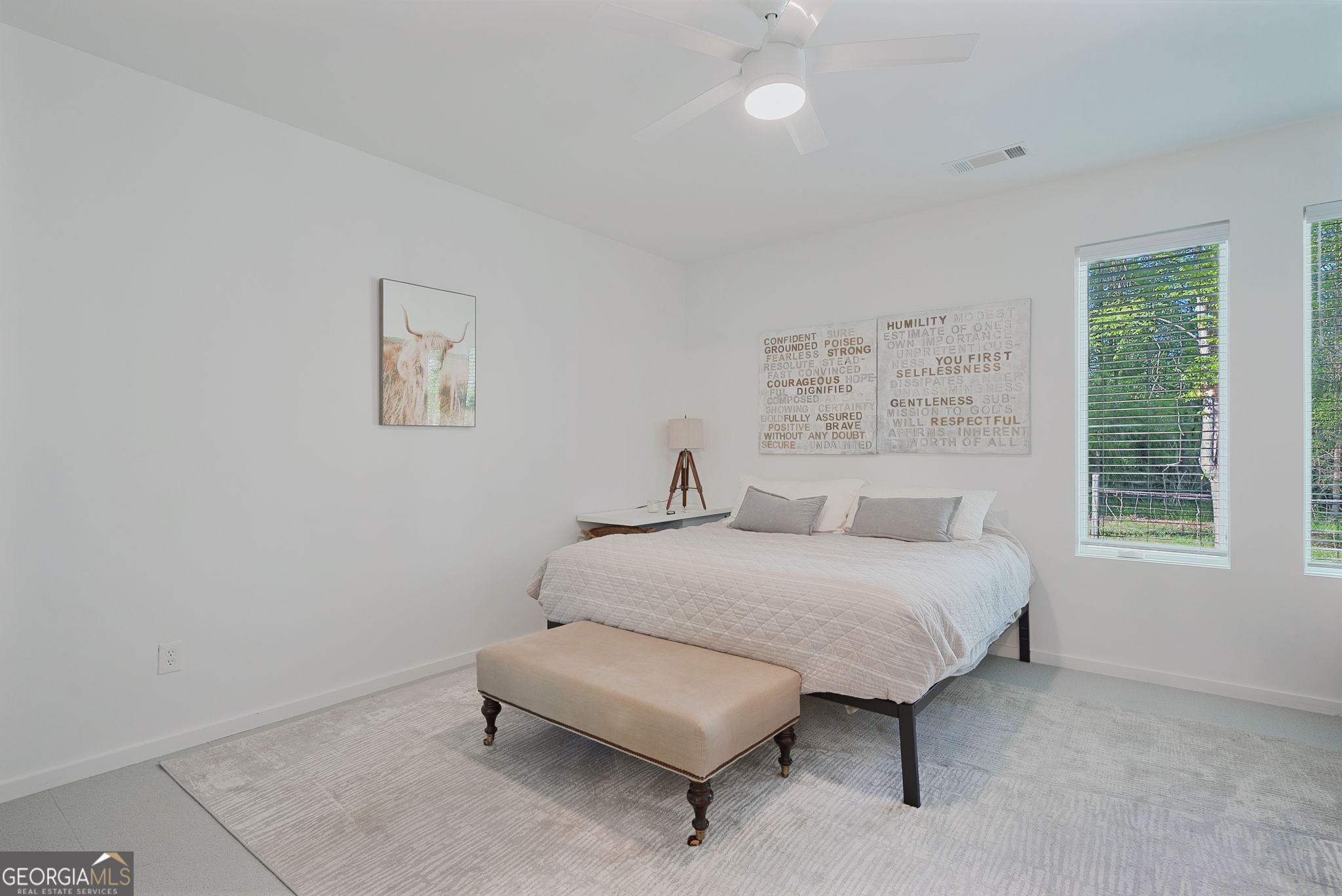 235 Glades Road Eatonton, GA 31024 - Photo 54 of 79 a spacious bedroom with a bed and a window
