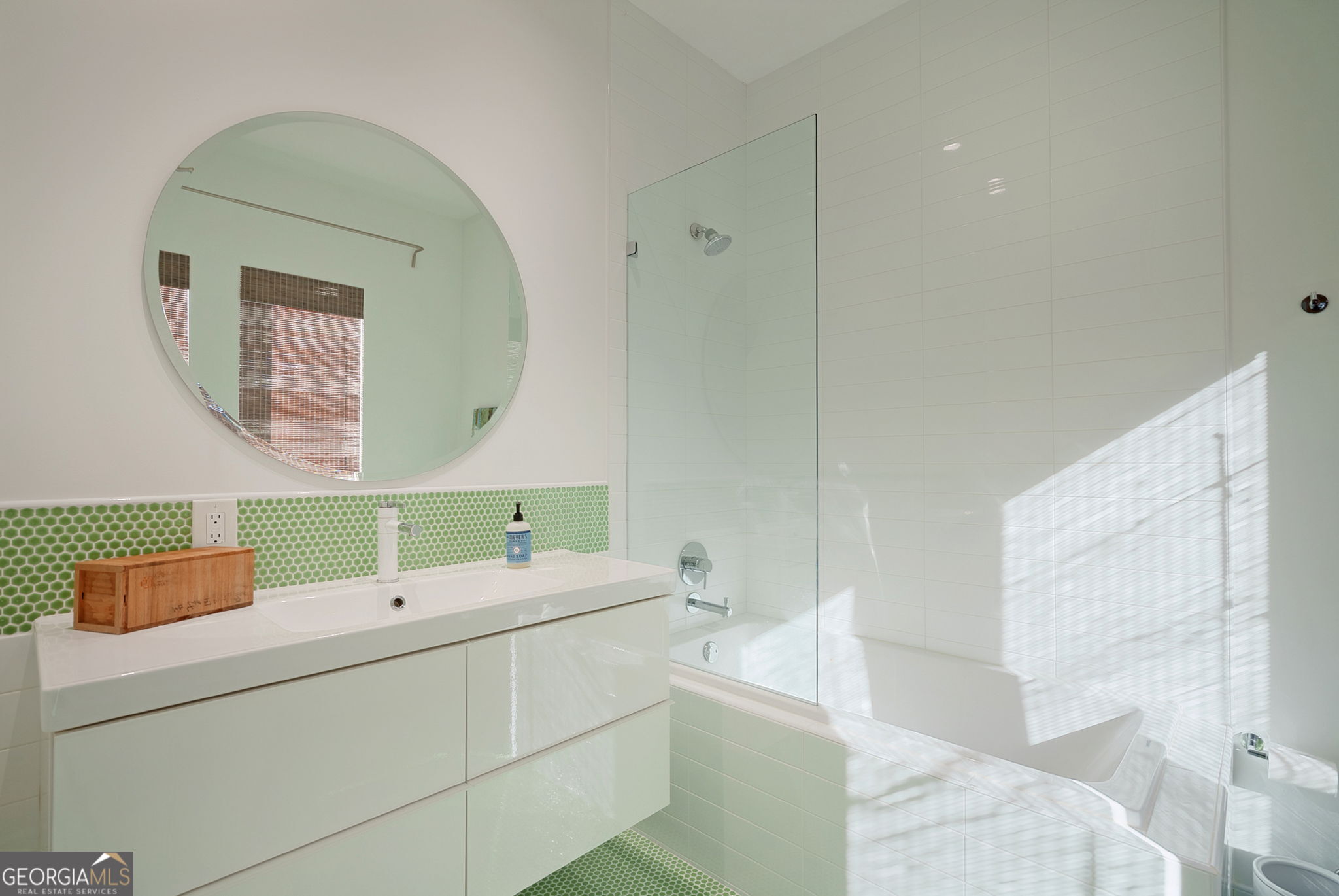 235 Glades Road Eatonton, GA 31024 - Photo 57 of 79 a bathroom with a sink and a mirror