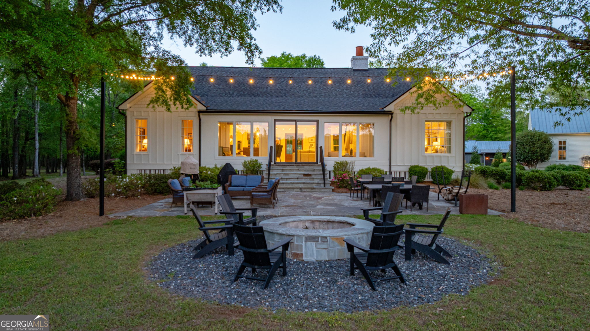 235 Glades Road Eatonton, GA 31024 - Photo 59 of 79 a view of a house with backyard porch and sitting area