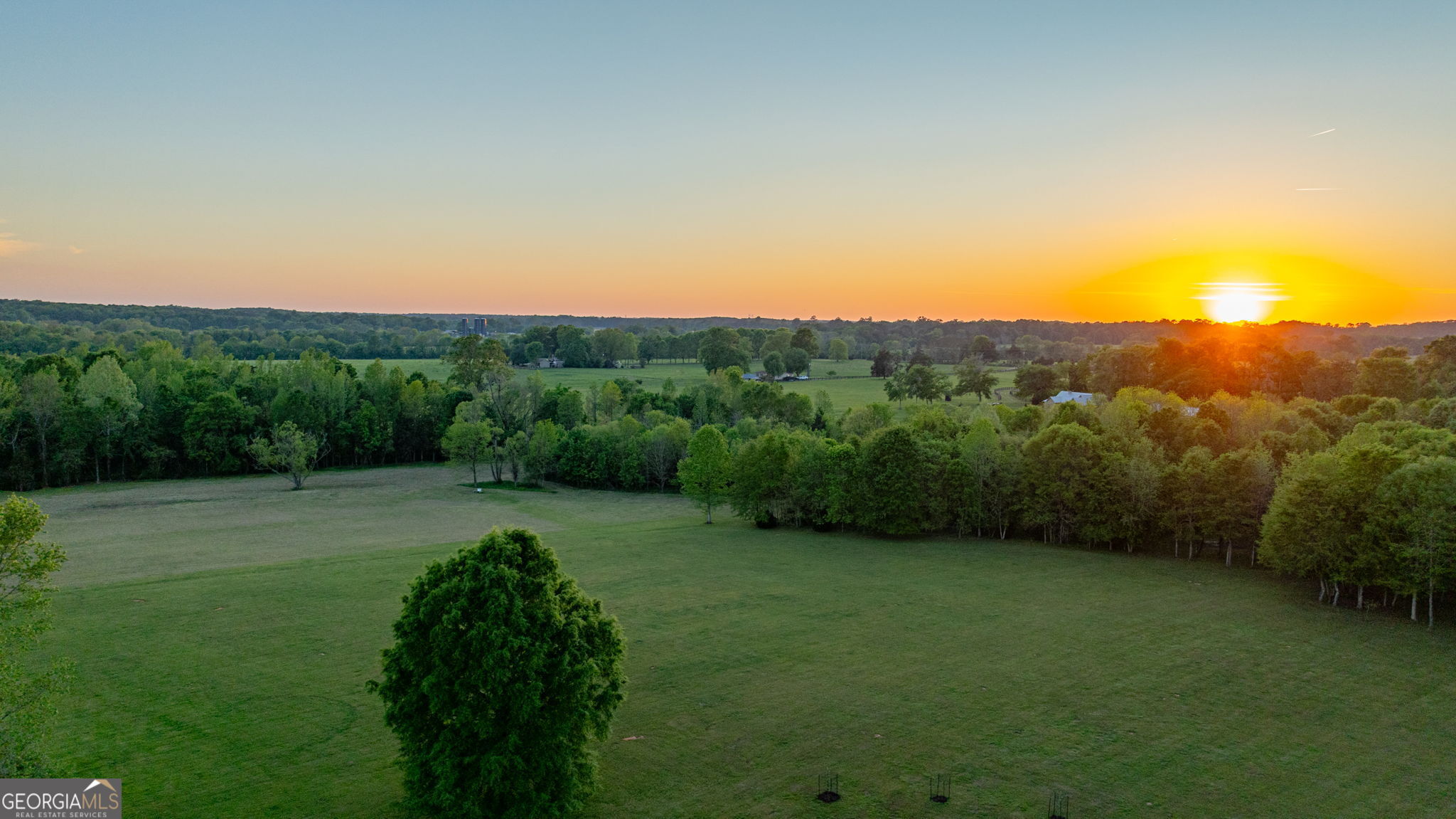 235 Glades Road Eatonton, GA 31024 - Photo 63 of 79 a view of a big yard with green space and mountain view in back