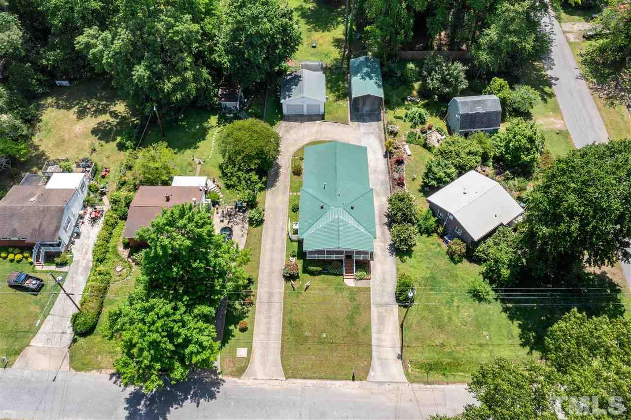Amazing home with metal roof, wrapped driveway, garage, huge carport and RV /Boat Carport.