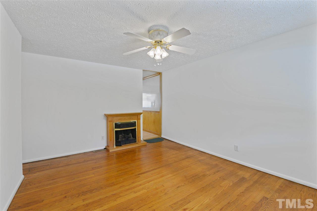 1421 Kelly Road Garner, NC 27529 - Photo 17 of 24 Pictured is the pretty gas fireplace in the living room