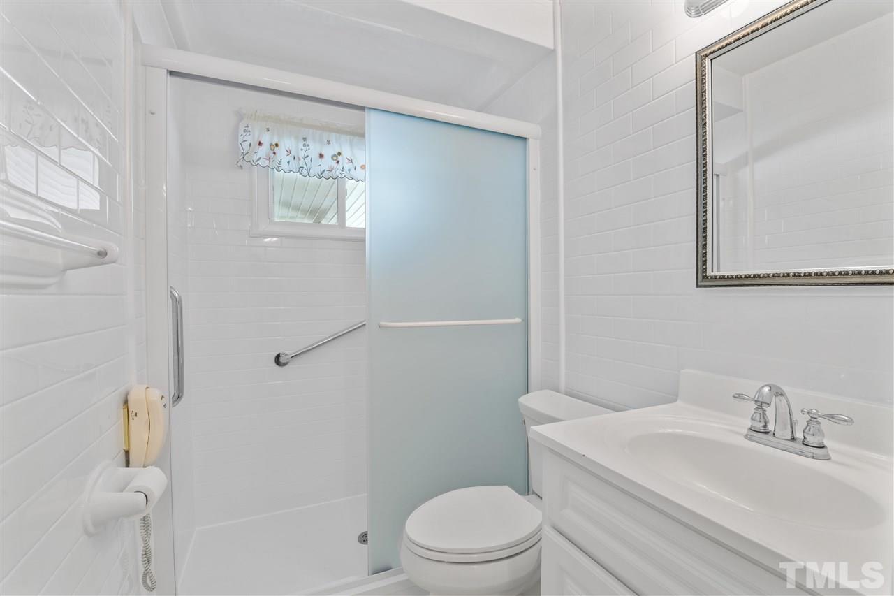 1421 Kelly Road Garner, NC 27529 - Photo 21 of 24 The bathroom was remodeled and features a walk in shower!