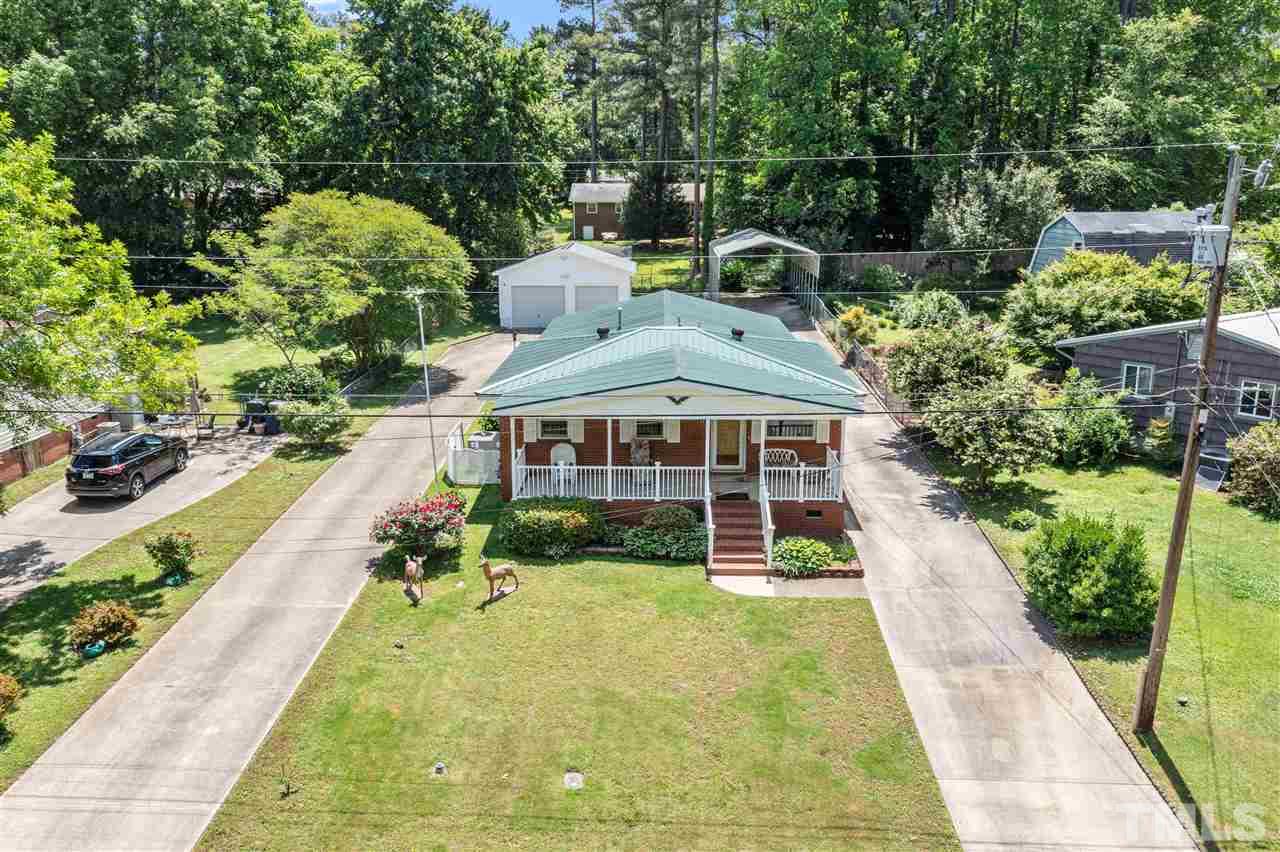 Welcome home! All. brick home in Hopedale! Driveway on both sides of the home wraps around to the rear of the home.