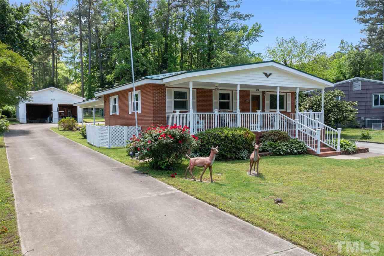 The left driveway leads to the garage/workshop, RV Carport