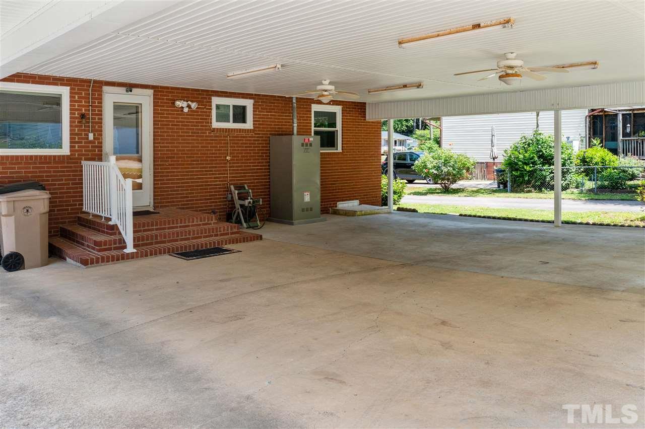 1421 Kelly Road Garner, NC 27529 - Photo 10 of 24 The carport is a great covered entry to the home!