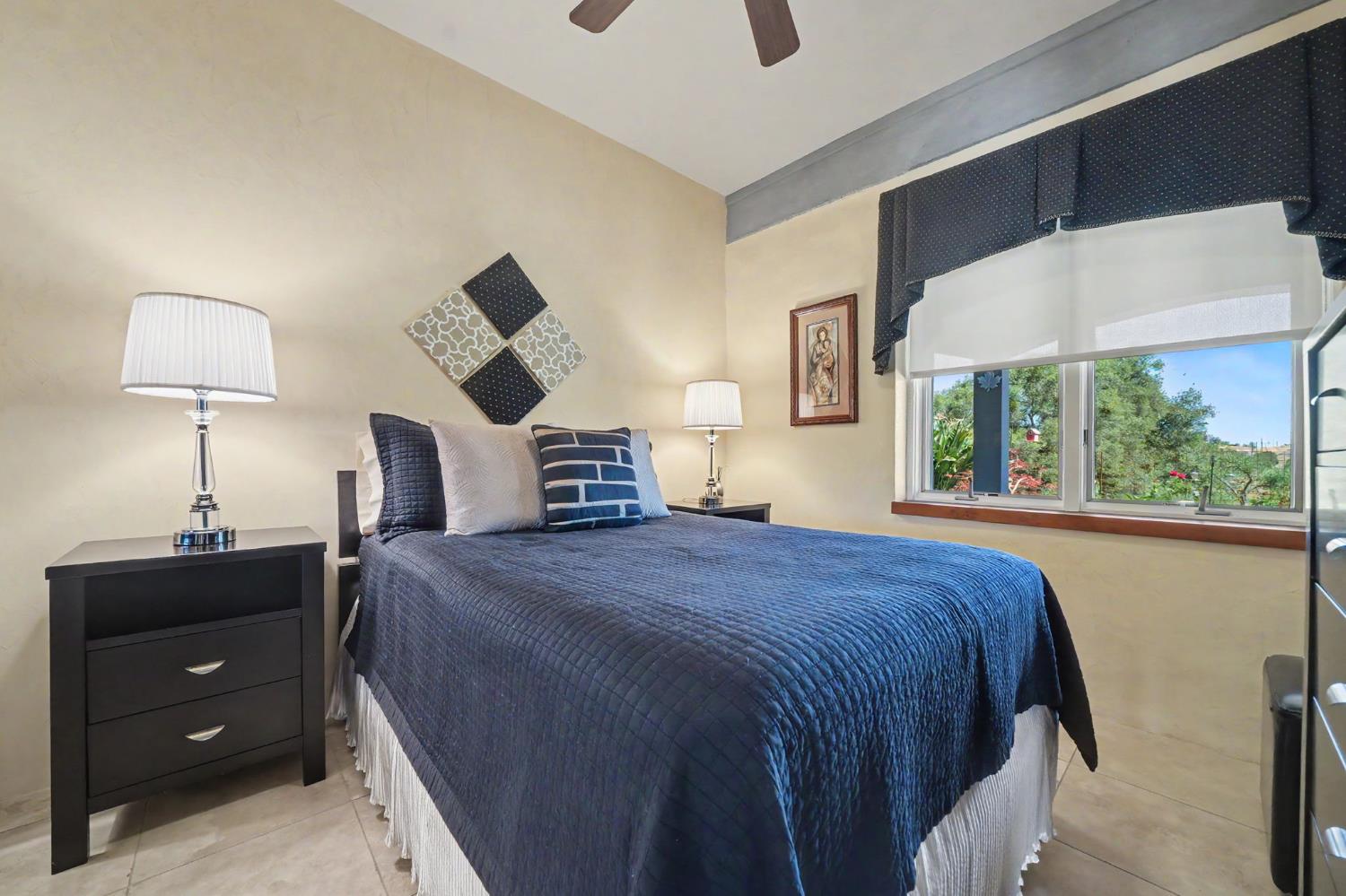 15070 Willow Creek Road Ione, CA 95640 - Photo 57 of 66 a bedroom with a bed and a window