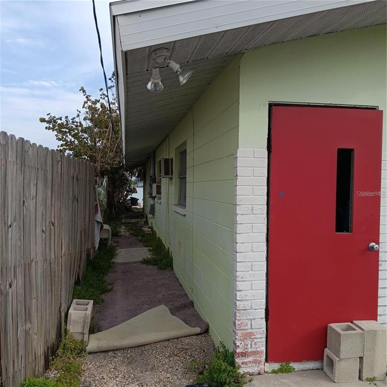 439 129th Avenue East Madeira Beach, FL 33708 - Photo 3 of 38 a view of a pathway of a house